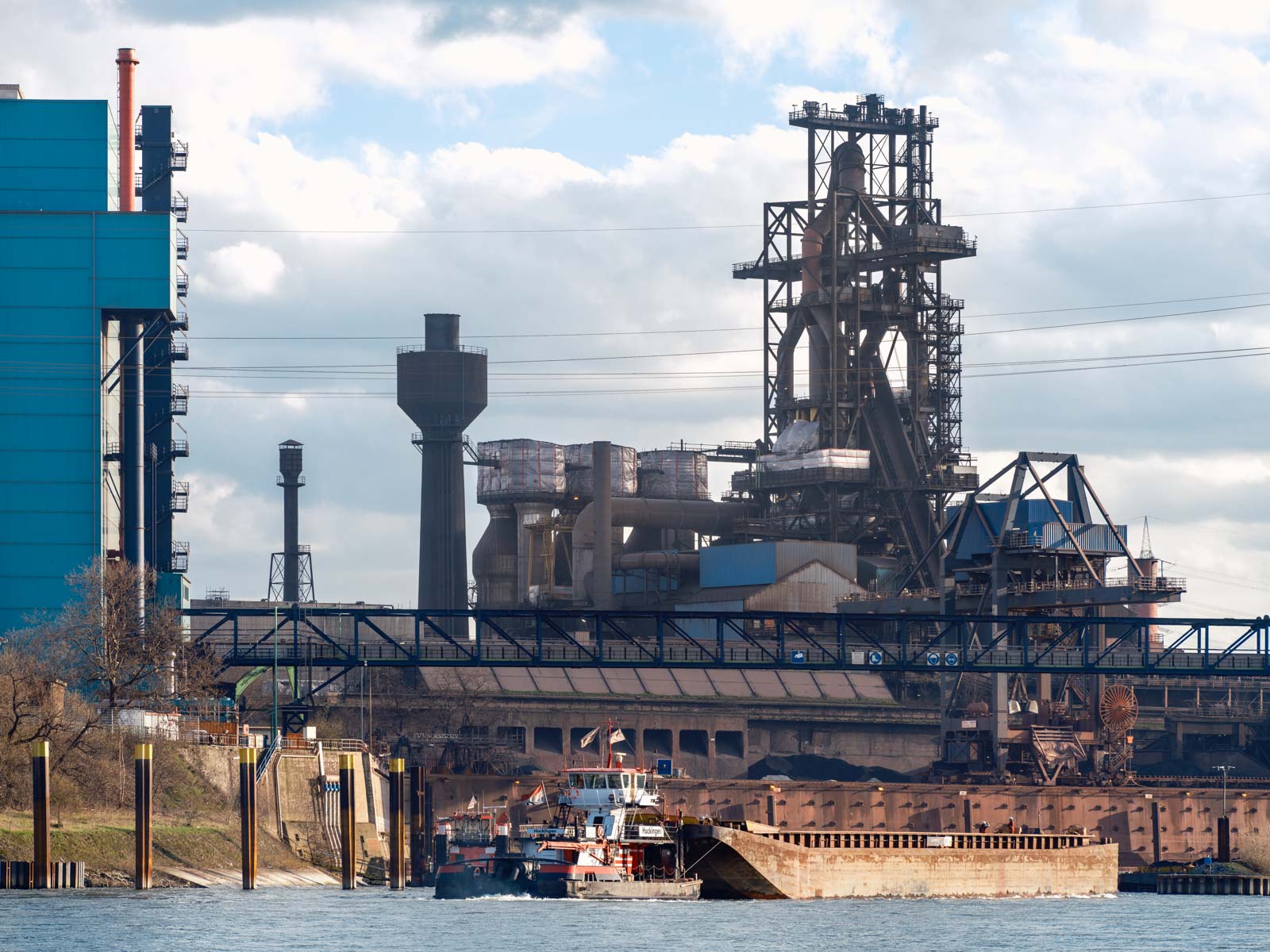Port and blast furnace at Krupp Mannesmann steelworks (HKM) in Duisburg on the Rhine in the late afternoon in March 2021 (Germany).