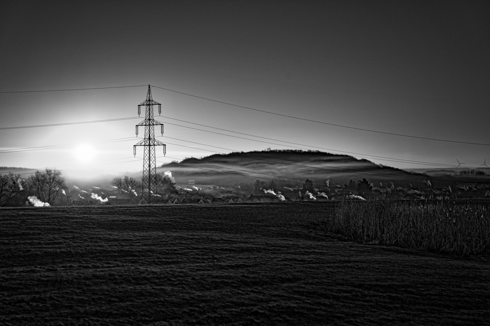 Photograph of a sunrise on top of a hill at 'Lippepark' in Hamm (Germany).