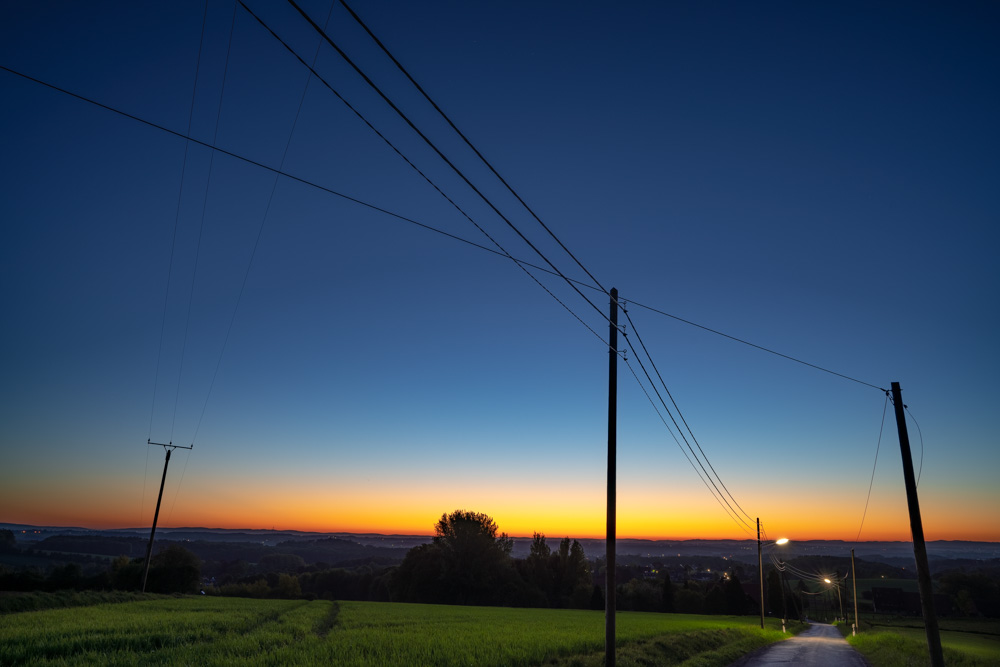 Power line poles at dawn (Kirchdornberg, Bielefeld).