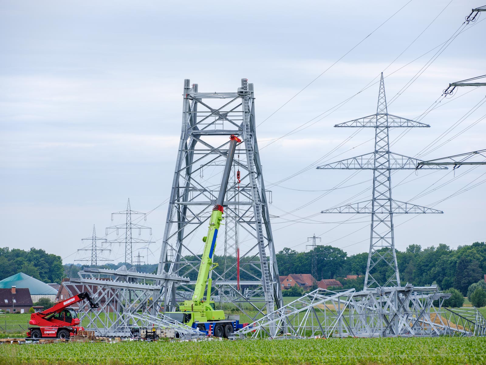 High-voltage lines under construction on a field (Halle in Westphalia, Germany).