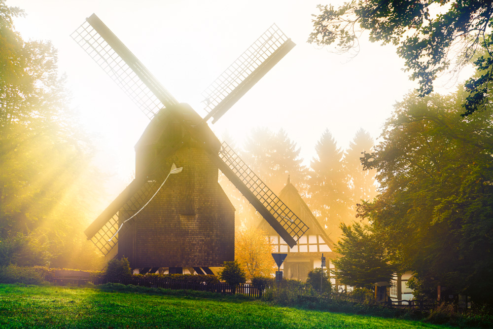 Windmill at the Bauernhaus-Museum in Bielefeld in the backlight. 