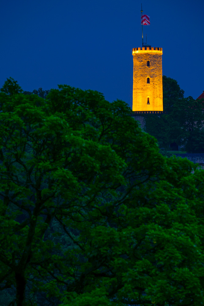Illuminated tower of the Sparrenburg in Bielefeld.