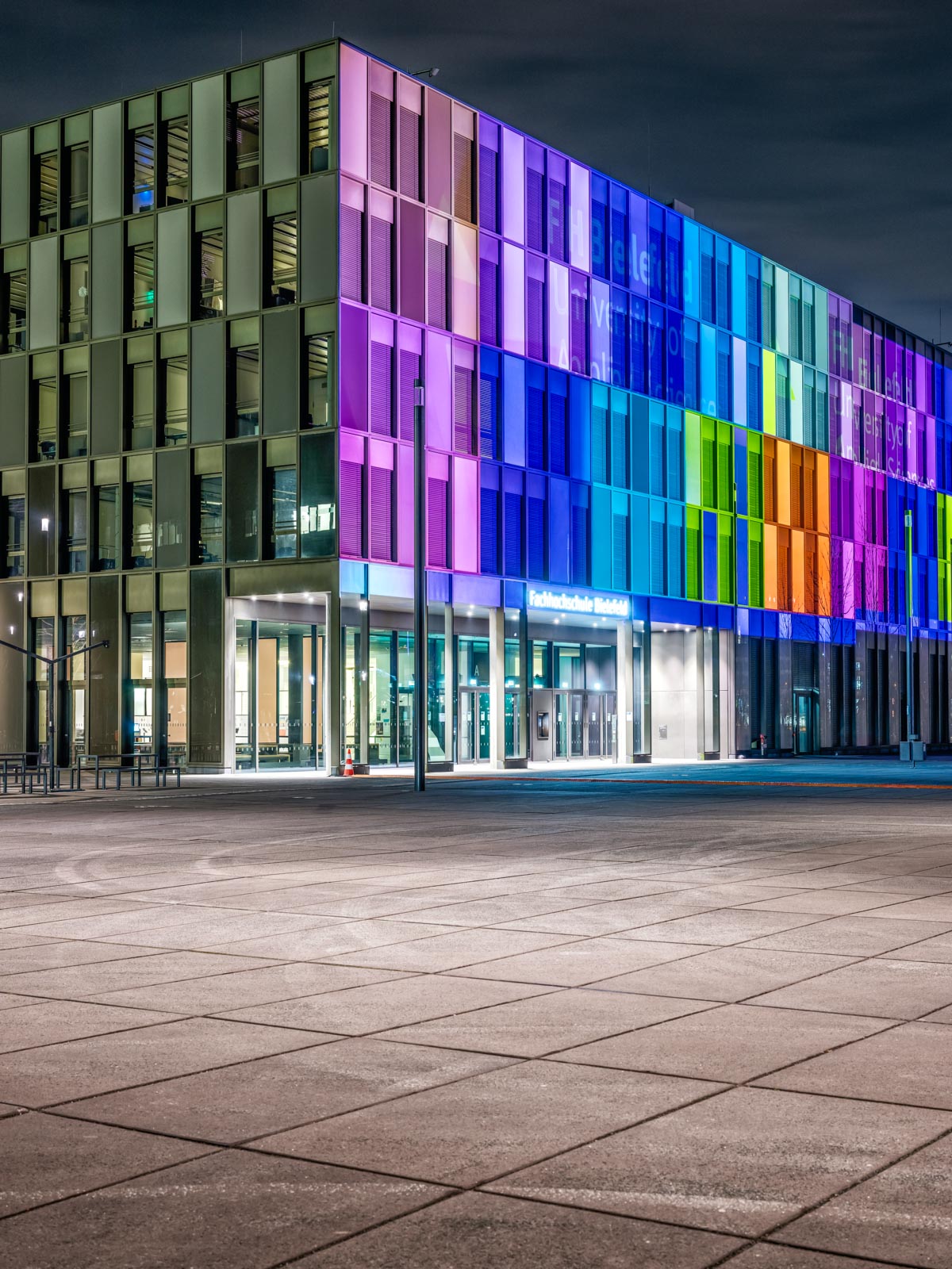Illuminated building of the University of Applied Sciences Bielefeld on the occasion of its 50th anniversary (Germany).