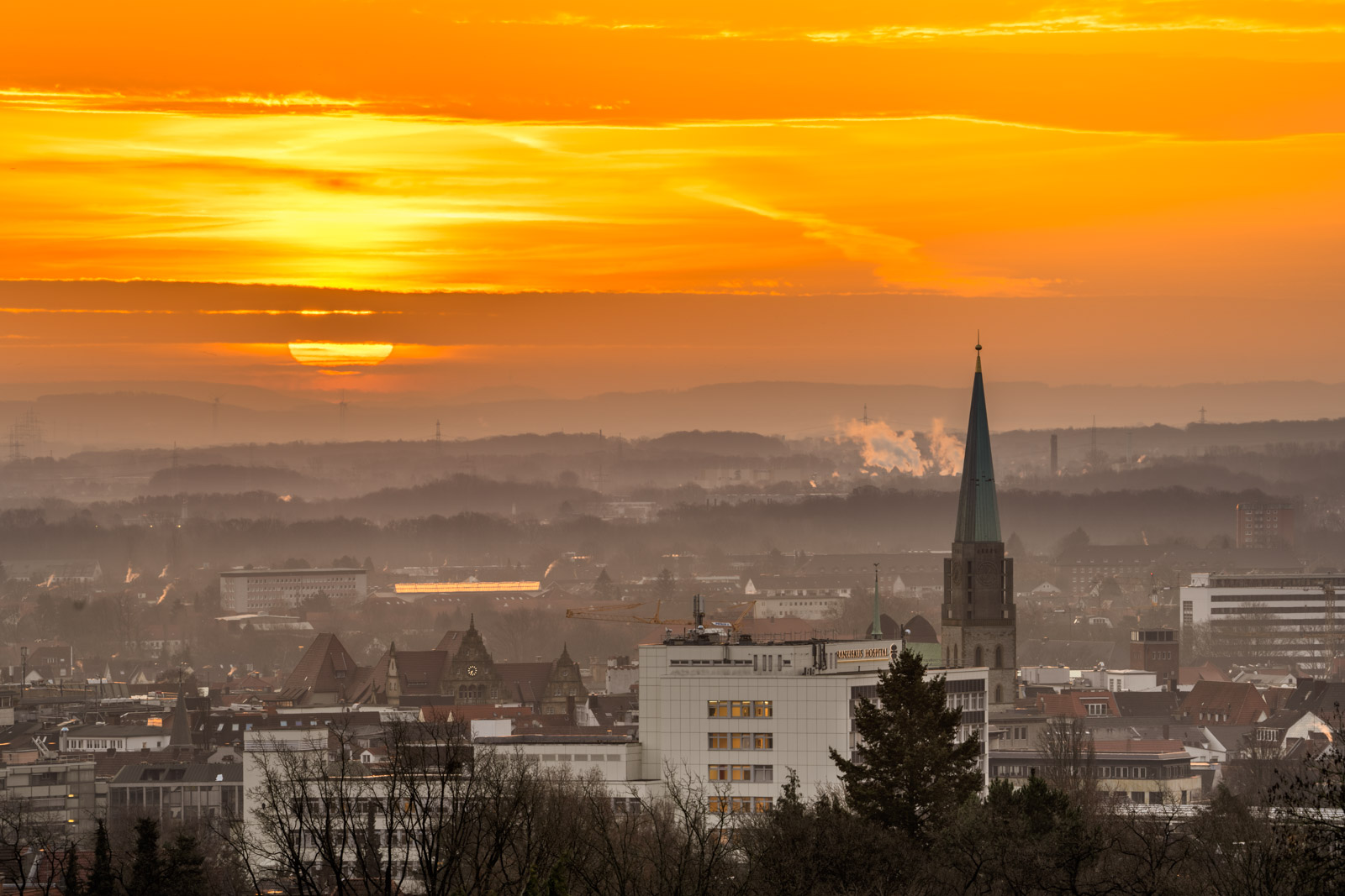 Sunrise over the city centre on 20 February 2021 (Bielefeld, Germany).