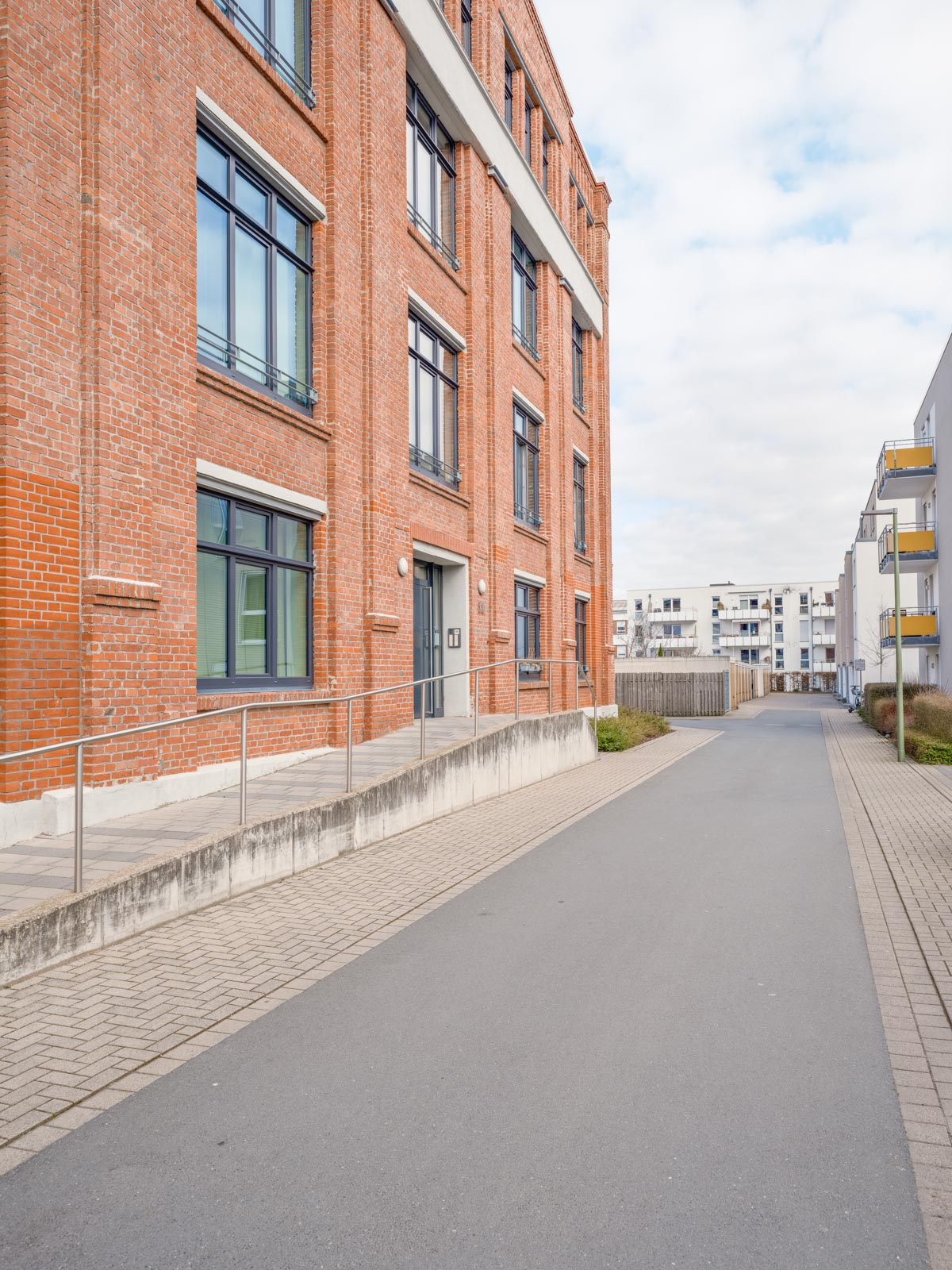 Side street in a newly built residential area in March 2021 (Bielefeld, Germany).
