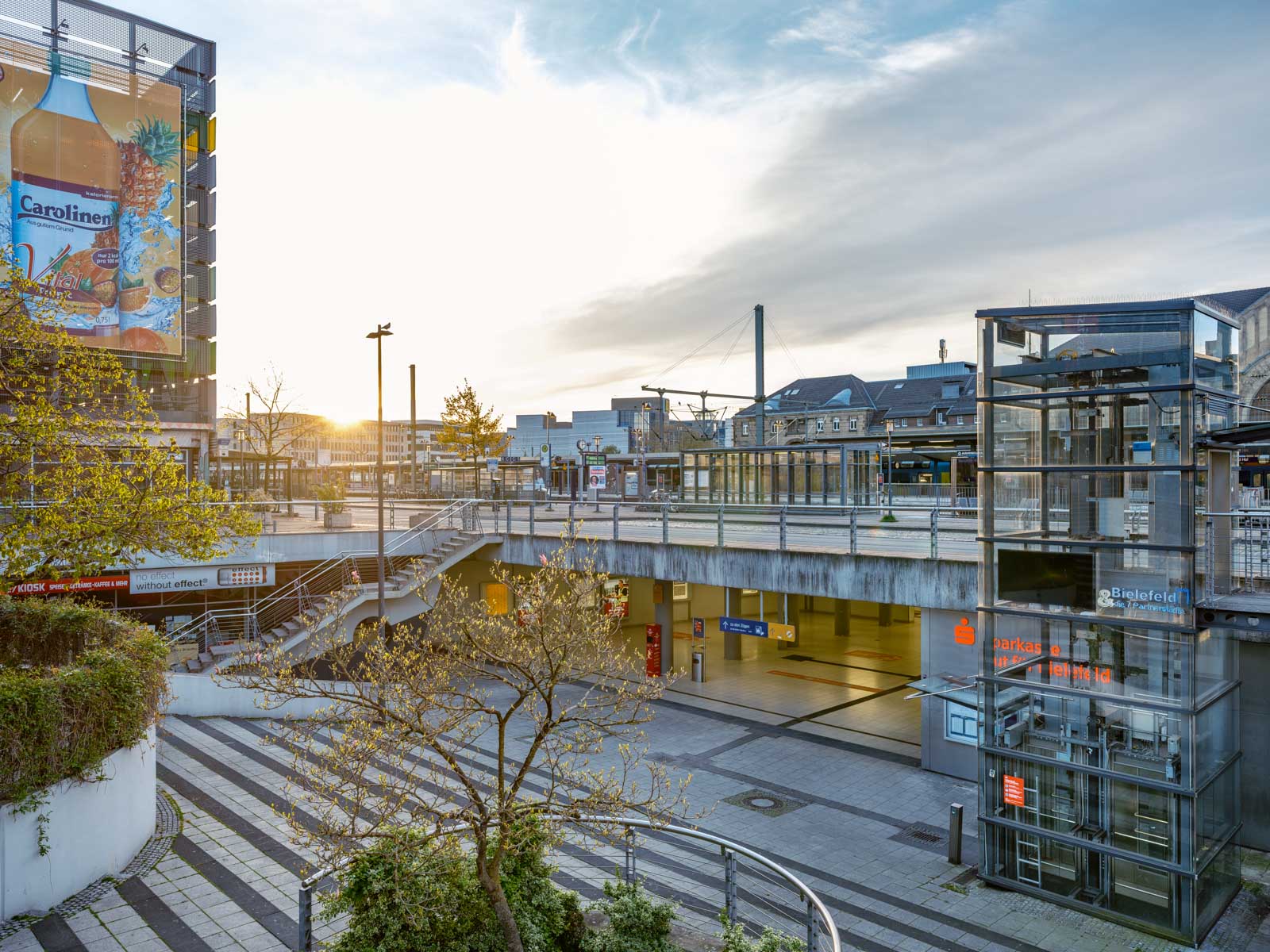 Sunrise at 'Ostwestfalen-Platz' at the main station in May 2021 (Bielefeld, Germany).