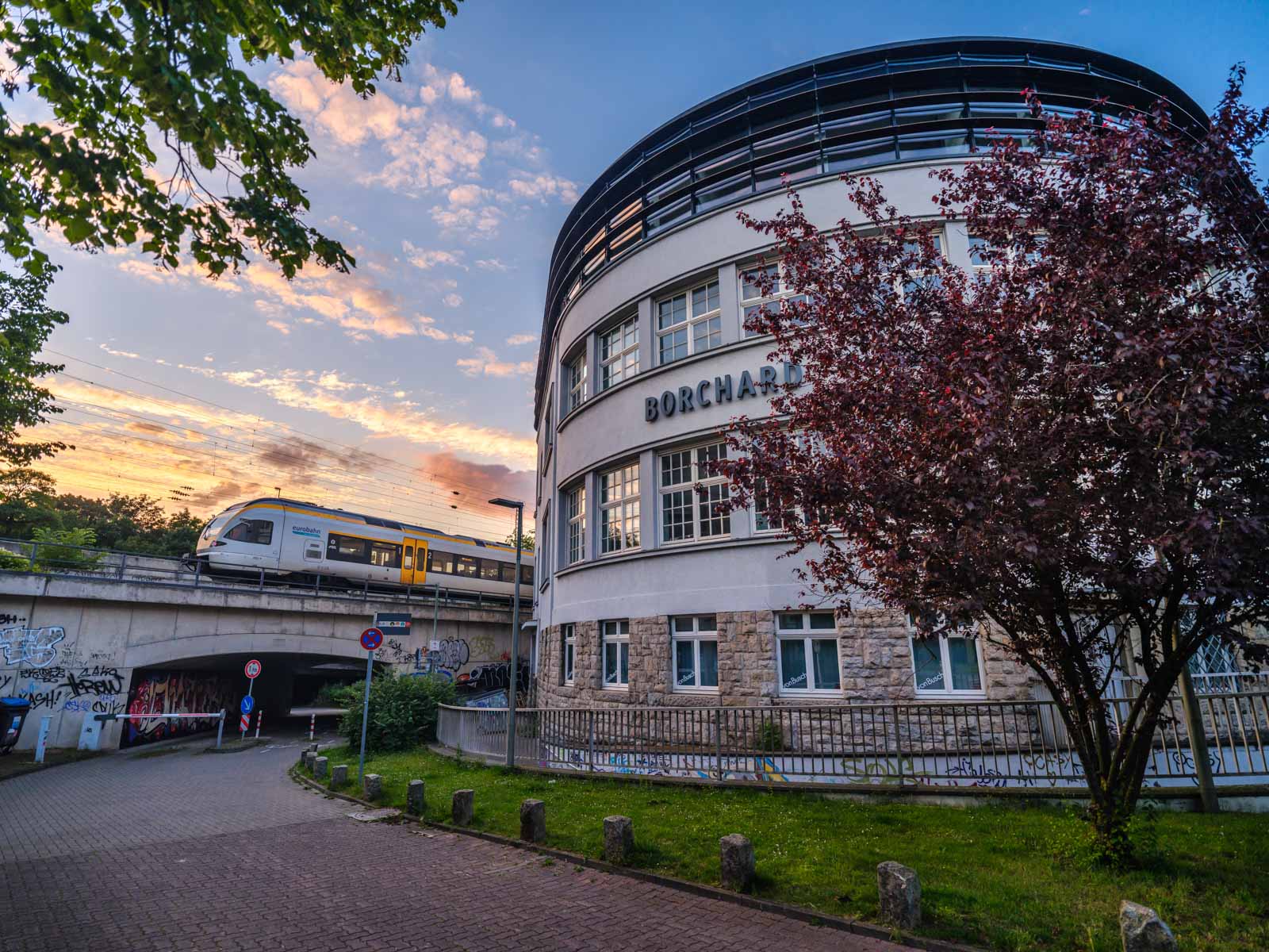 KONTOR building at the railroad embankment at sunset in July 2021 (Bielefeld, Germany).