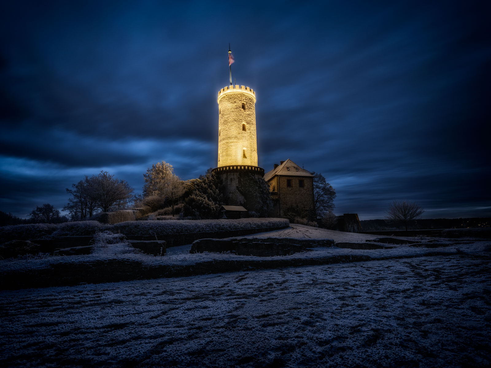 Stormy winter night at Sparrenburg Castle in December 2021 (Bielefeld, Germany).